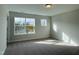 Bright bedroom with large windows offering ample natural light, carpet floors, and neutral walls provides a cozy space at 492 Traditions Grande Blvd # 26, Wake Forest, NC 27587