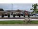 Attractive brick building with parking lot and landscaping under cloudy skies at 492 Traditions Grande Blvd # 26, Wake Forest, NC 27587