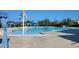 Large community pool featuring colorful umbrellas and covered cabanas for residents to enjoy on a hot day at 492 Traditions Grande Blvd # 26, Wake Forest, NC 27587