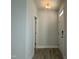 Bright entryway with wood flooring and a white front door leads to other rooms at 492 Traditions Grande Blvd # 26, Wake Forest, NC 27587