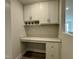 This office nook features overhead cabinets, granite countertops, and built-in drawers, perfect for a home workspace at 492 Traditions Grande Blvd # 26, Wake Forest, NC 27587