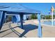 Community pool area with several blue covered cabanas for residents with some sun protection at 492 Traditions Grande Blvd # 26, Wake Forest, NC 27587