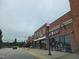 Retail strip mall with various businesses including a cleaners and quilted fabric store at 492 Traditions Grande Blvd # 26, Wake Forest, NC 27587