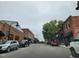 Charming street view with brick buildings and mature trees at 492 Traditions Grande Blvd # 26, Wake Forest, NC 27587