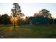 This barn is situated in a grassy lawn with mature trees at 804 Ambercrest Place, Durham, NC 27705