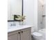 Bright bathroom featuring a sleek vanity, toilet, and tiled shower-tub combination at 804 Ambercrest Place, Durham, NC 27705