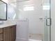 This bathroom features a large shower with white subway tile and gray tile floors at 804 Ambercrest Place, Durham, NC 27705