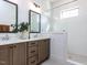 This bathroom features a double sink vanity with white countertops and large shower with white subway tile at 804 Ambercrest Place, Durham, NC 27705