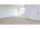 This bedroom features neutral carpet and light neutral paint colors at 804 Ambercrest Place, Durham, NC 27705