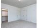 Clean bedroom with neutral carpet, bright lighting, and a walk-in closet at 804 Ambercrest Place, Durham, NC 27705