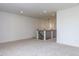Bright bonus room featuring neutral carpet, recessed lighting, and a staircase landing at 804 Ambercrest Place, Durham, NC 27705