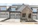 Charming townhome showcasing a two-car garage, brick accents, and manicured landscaping at 804 Ambercrest Place, Durham, NC 27705