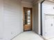 Stylish wood front door providing a warm welcome to this charming home at 804 Ambercrest Place, Durham, NC 27705