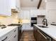 Modern kitchen with stainless steel appliances, white cabinets, and granite countertops at 804 Ambercrest Place, Durham, NC 27705