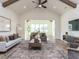 Spacious living room with vaulted ceilings, ceiling fan, and large rug at 804 Ambercrest Place, Durham, NC 27705