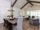 Open-concept living and dining area with vaulted ceilings and wooden beams at 804 Ambercrest Place, Durham, NC 27705