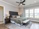 Main bedroom featuring a large bed, nightstands, and ample natural light at 804 Ambercrest Place, Durham, NC 27705