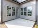 A concrete patio features a corner location with multiple windows and a glass door entry at 804 Ambercrest Place, Durham, NC 27705