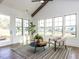 Bright sunroom featuring vaulted ceilings, multiple windows, and comfortable seating at 804 Ambercrest Place, Durham, NC 27705