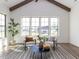 Bright sunroom with vaulted ceiling, large windows, and seating at 804 Ambercrest Place, Durham, NC 27705