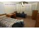 Bedroom with two beds, ceiling fan, dresser and study desk at 2913 Wadsworth Ave, Durham, NC 27707