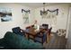Cozy dining room with hardwood floors, wood table and six chairs, and natural lighting at 2913 Wadsworth Ave, Durham, NC 27707