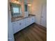 Bathroom features a double sink vanity with granite counters at 103 Sage Ln # 009, Four Oaks, NC 27524