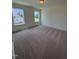 Bright bedroom with two windows and neutral carpet at 103 Sage Ln # 009, Four Oaks, NC 27524