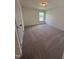 Cozy bedroom with a window and neutral carpet at 103 Sage Ln # 009, Four Oaks, NC 27524