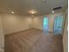 Large bonus room with plush carpet and plenty of natural light at 103 Sage Ln # 009, Four Oaks, NC 27524