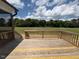 Open wood deck area with railing offering backyard views at 103 Sage Ln # 009, Four Oaks, NC 27524