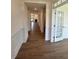 Long hallway featuring hardwood flooring and bright white trim at 103 Sage Ln # 009, Four Oaks, NC 27524