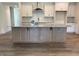 Spacious kitchen island featuring seating and storage at 103 Sage Ln # 009, Four Oaks, NC 27524