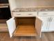 Kitchen cabinets featuring a pull-out drawer shelf for optimal organization at 103 Sage Ln # 009, Four Oaks, NC 27524