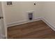 Well-maintained laundry room with hardwood flooring at 103 Sage Ln # 009, Four Oaks, NC 27524