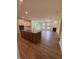 Open-concept living space featuring hardwood floors, ample natural light, and modern finishes at 103 Sage Ln # 009, Four Oaks, NC 27524