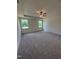 Spacious main bedroom features a ceiling fan and windows with backyard views at 103 Sage Ln # 009, Four Oaks, NC 27524