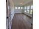 Sunlit office space boasting hardwood floors, wainscoting, and large windows overlooking the front yard at 103 Sage Ln # 009, Four Oaks, NC 27524