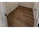 Walk-in pantry features wood-look floors and wire shelving at 103 Sage Ln # 009, Four Oaks, NC 27524