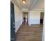 Elegant entryway featuring hardwood floors, wainscoting, and open floor plan with a fireplace view at 123 Sage Ln # 010, Four Oaks, NC 27524