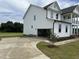 Spacious two-story house featuring attached garage, concrete driveway, and a lush green lawn at 123 Sage Ln # 010, Four Oaks, NC 27524