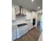 Modern kitchen with stainless steel appliances, granite countertops, and white cabinets at 123 Sage Ln # 010, Four Oaks, NC 27524