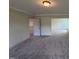 Spacious carpeted main bedroom features two large windows and ample natural light at 123 Sage Ln # 010, Four Oaks, NC 27524