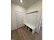 Mud room with hooks and bench for storage of shoes and outerwear near the door at 123 Sage Ln # 010, Four Oaks, NC 27524