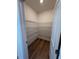 Walk-in pantry features wire shelving and hardwood flooring at 123 Sage Ln # 010, Four Oaks, NC 27524