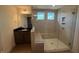Modern bathroom featuring a glass shower with a built-in bench and tiled walls at 123 Sage Ln # 010, Four Oaks, NC 27524