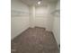 Spacious walk-in closet with wire shelving and neutral carpeting at 123 Sage Ln # 010, Four Oaks, NC 27524