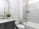 Clean bathroom featuring a sink vanity, toilet and shower tub at 6059 Scalybark Road, Durham, NC 27712