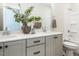 Stylish bathroom featuring a double vanity, quartz countertop, and a sleek shower/tub combination at 6059 Scalybark Road, Durham, NC 27712