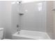 Modern bathroom featuring a tiled shower and bathtub with a chrome showerhead at 6059 Scalybark Road, Durham, NC 27712